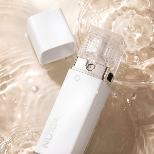 Open NUXIA Micro Airshot device on a luminous water surface